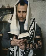 A picture sent to the Rebbe of a Russian Jew in tefillin and saying the Shema in secret